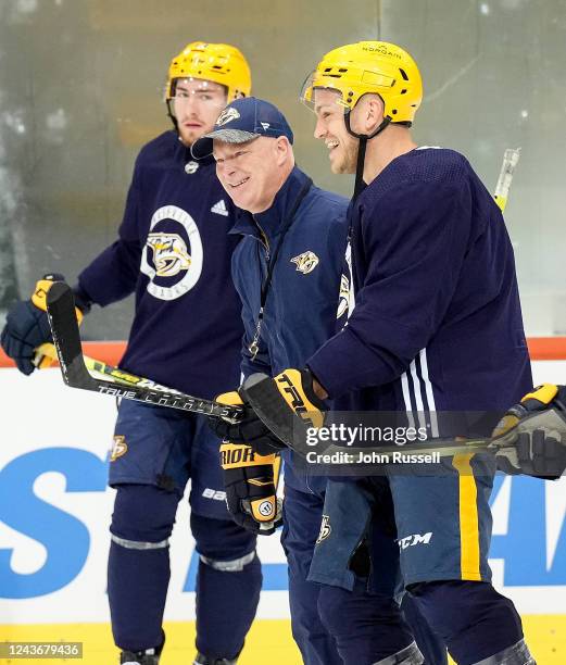 Head coach John Hynes has a laugh with Mark Borowiecki of the Nashville Predators during practice for the 2022 NHL Global Series Switzerland, at...