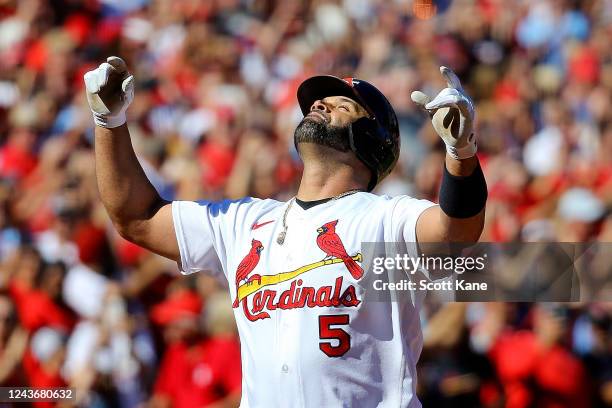 Albert Pujols of the St. Louis Cardinals gestures skyward after hitting a solo home run during the third inning against the Pittsburgh Pirates at...