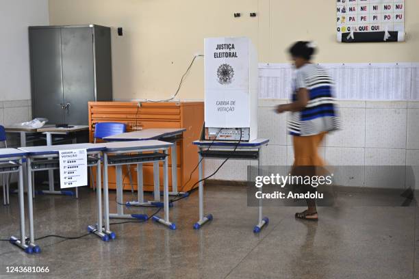 Woman arrives to cast her vote at a polling station during the presidential election, in Brasilia, Brazil October 2, 2022.