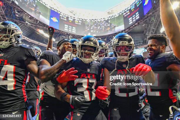 Atlantas defensive unit celebrates the interception by cornerback Dee Alford in the final minute during the NFL game between the Cleveland Browns and...