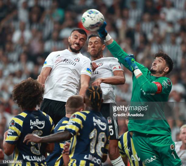 Altay Bayindir of Fenerbahce in action against Josef and Saiss of Besiktas during the Turkish Super Lig week 8 soccer match between Besiktas and...