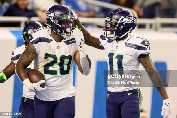 Seattle Seahawks running back Rashaad Penny is congratulated after making touchdown by Seattle Seahawks wide receiver Marquise Goodwin during an NFL...