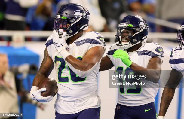 Seattle Seahawks running back Rashaad Penny is congratulated after making touchdown by Seattle Seahawks wide receiver Penny Hart during an NFL...