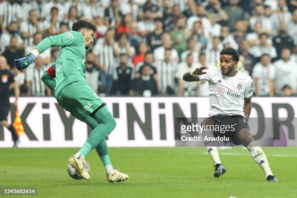 Altay Bayindir of Fenerbahce in action against Valentin Rosier of Besiktas during the Turkish Super Lig week 8 soccer match between Besiktas and...