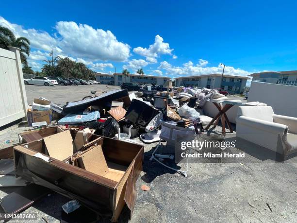 Water-damaged furniture waits to be picked up at the Stillwater Cove apartments in Naplesâ River Park neighborhood on Saturday, Oct. 1 in Florida.