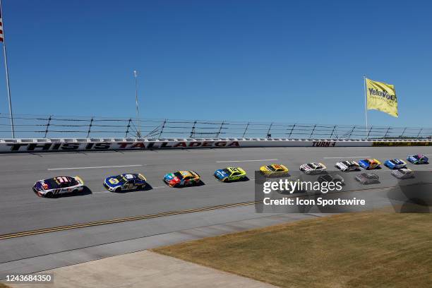 Denny Hamlin leads the field of cars through the 4th turn during the running of the Yellawood 500 NASCAR Cup Series Playoff race on October 2, 2022...