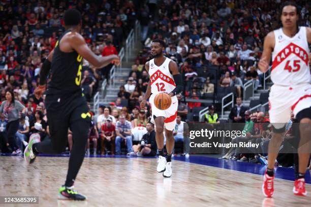 Josh Jackson of the Toronto Raptors dribbles the ball against the Utah Jazz during a preseason game on October 2, 2022 at the Rogers Place in...