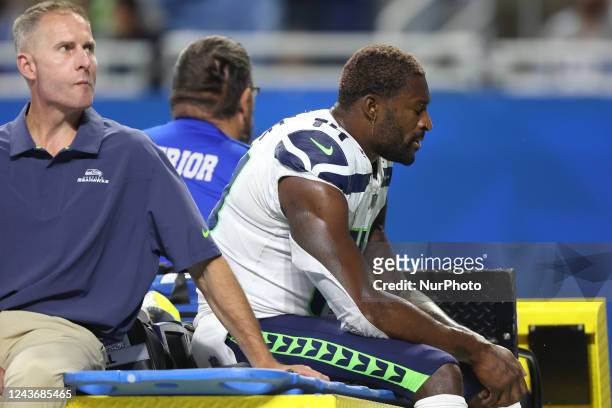 Seattle Seahawks wide receiver DK Metcalf is taken off the field during the second half of an NFL football game against the Detroit Lions in Detroit,...