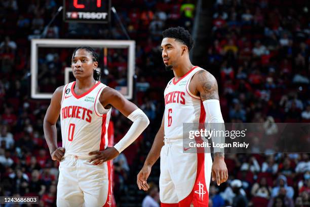 TyTy Washington and Kenyon Martin Jr. #6 of the Houston Rockets look on during a preseason game against the San Antonio Spurs on October 2, 2022 at...