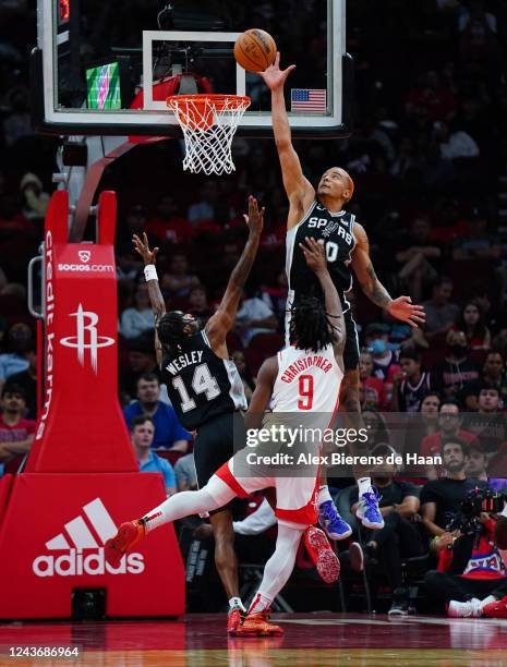 Jeremy Sochan of the San Antonio Spurs blocks the shot of Josh Christopher of the Houston Rockets during the game at Toyota Center on October 02,...
