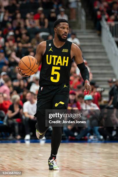 Malik Beasley of the Utah Jazz handles the ball during the game against the Toronto Raptors on October 2, 2022 at Rogers Place in Edmonton, Alberta,...
