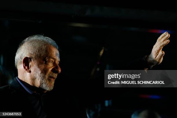Brazilian former President and candidate for the leftist Workers Party Luiz Inacio Lula da Silva waves to supporters after learning the results of...