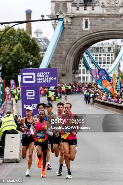 Male Elite participants of TCS 2022 London Marathon run through the Tower Bridge in central London. Nearly 42,000 runners participated in the 2022...