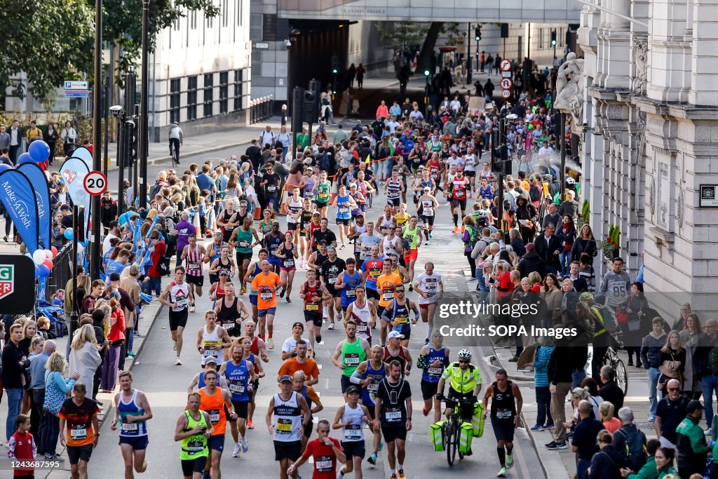 Participants of TCS 2022 London Marathon run through central...