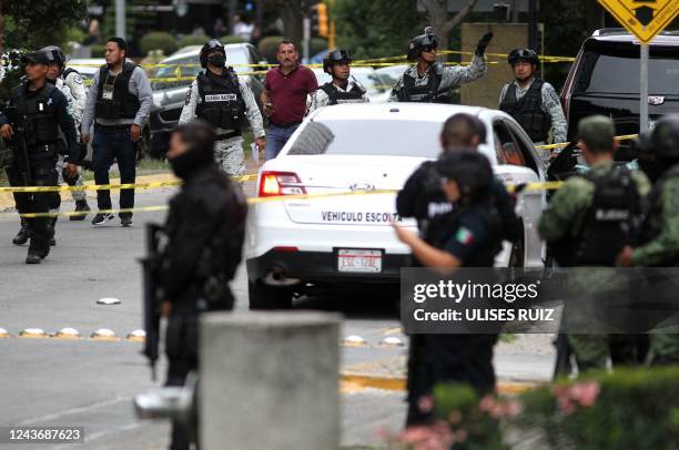 Elements of the National Guard guard the area where a shooting took place at the Andares shopping mall in Zapopan, Jalisco state, Mexico, on October...