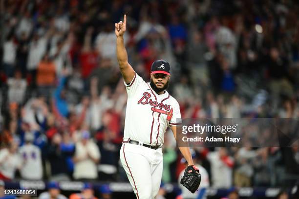 Kenley Jansen of the Atlanta Braves celebrates after saving the game during the ninth inning against the New York Mets at Truist Park on October 2,...
