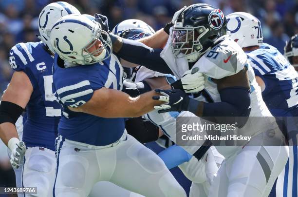 Braden Smith of the Indianapolis Colts blocks against Kevin Strong of the Tennessee Titans during the game at Lucas Oil Stadium on October 2, 2022 in...