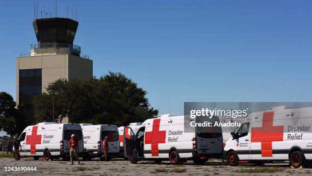 Red Cross disaster relief vans from across the country are seen at a staging area at Orlando Executive Airport on October 1, 2022 in Orlando,...