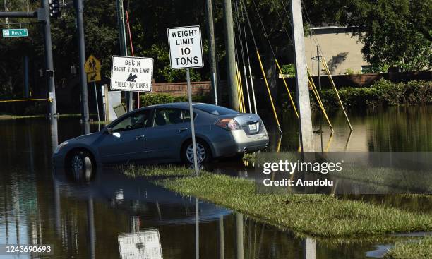 An abandoned car is seen in a road that was flooded by rain from Hurricane Ian on October 1, 2022 in Orlando, Florida. The storm caused widespread...