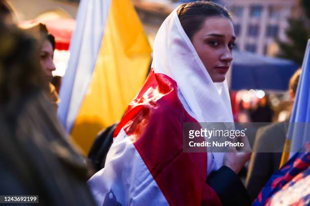 Woman with Belarusian White-red-white flag during the meeting with Belarusian opposition leader Svetlana Tsikhanouskaya, at the Main Square in...