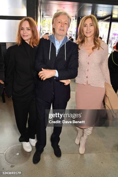 Stella McCartney, Sir Paul McCartney and Nancy Shevell pose backstage at the Stella McCartney show during Paris Fashion Week Womenswear Spring/Summer...