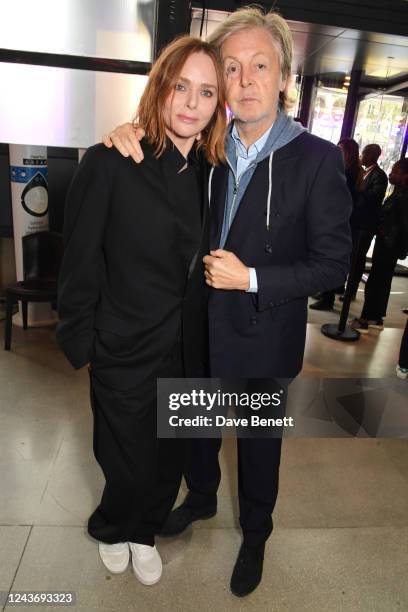 Stella McCartney and Sir Paul McCartney pose backstage at the Stella McCartney show during Paris Fashion Week Womenswear Spring/Summer 2023 at Centre...