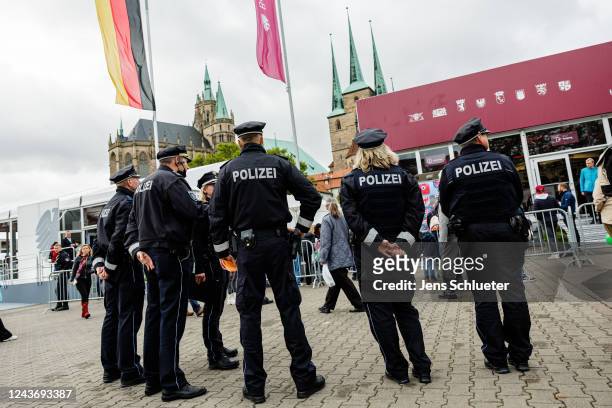 Police officers secure the German Unity Day celebrations in the city centre on October 3, 2022 in Erfurt, Germany. On 3 October 1990, the two...