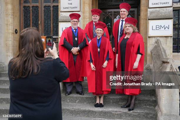 The Notaries Society of England of Wales have their photograph taken on the steps of the Faculty Office in Dean's Yard as members of the judiciary...
