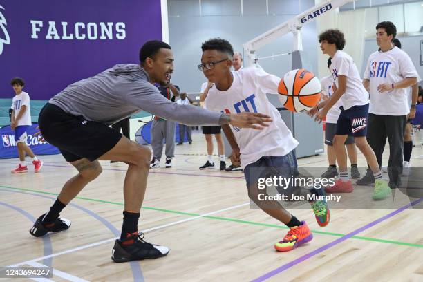 John Collins of the Atlanta Hawks coaches kids during an NBA Cares Event as part of 2022 NBA Global Games Abu Dhabi at NYU on October 3, 2022 in Abu...