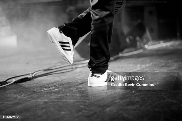The Adidas trainers of a member of hip hop group Run DMC as they perform on stage at Manchester Apollo, 25th May 1987.