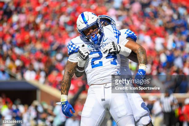 Kentucky running back Chris Rodriguez Jr. Is lifted by teammates in celebration after he scores during the college football game between the Kentucky...
