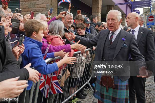 King Charles III greets members of the public as he arrives at an official council meeting at the City Chambers in Dunfermline, Fife, to formally...
