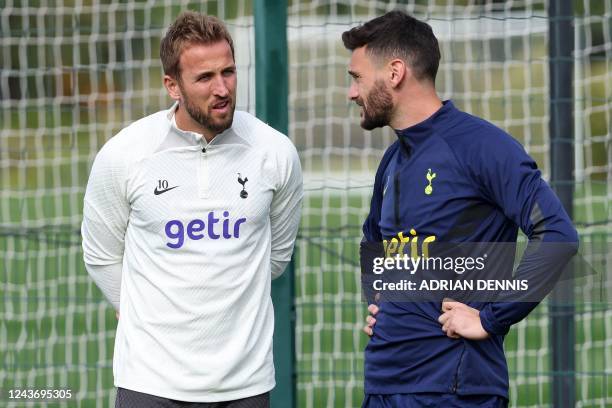 Tottenham Hotspur's English striker Harry Kane and Tottenham Hotspur's French goalkeeper Hugo Lloris attend a team training session at Tottenham...