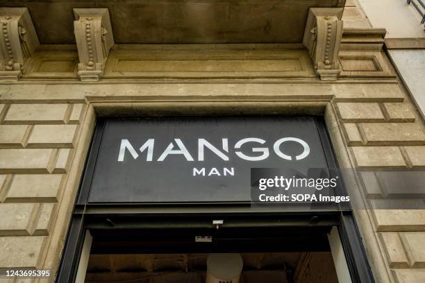 The logo of the Spanish apparel and clothing chain Mango is seen on top of store entrance.