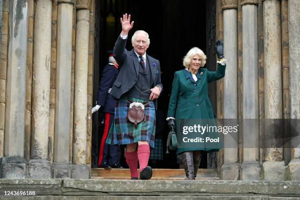 King Charles III and Camilla, Queen Consort waves as they leave Dunfermline Abbey, after a visit to mark its 950th anniversary, and after attending a...