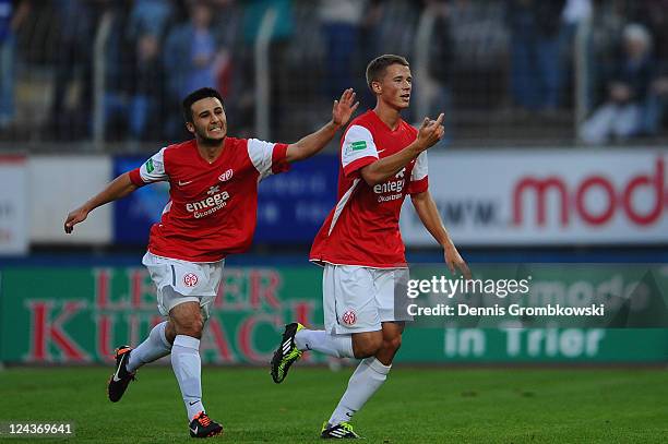 Erik Durm of Mainz celebrates with team mates after scoring his team's opening goal during the Regionalliga West match between SV Eintracht Trier 05...