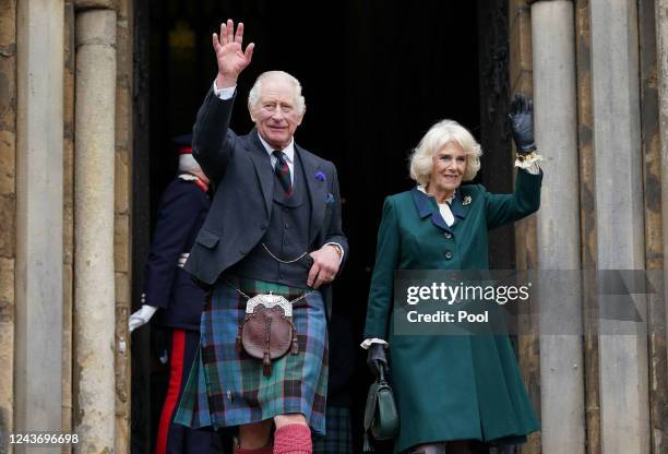 King Charles III and Camilla, Queen Consort, waves as they leave Dunfermline Abbey, after a visit to mark its 950th anniversary, and after attending...