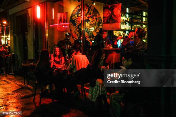 Customers sit at terrace tables outside a restaurant in central London, UK, on Friday, Sept. 30, 2022. UK retailers are facing a mortgage time bomb,...