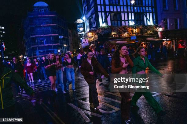 Pedestrians cross a junction in the west end of central London, UK, on Friday, Sept. 30, 2022. UK retailers are facing a mortgage time bomb, with...