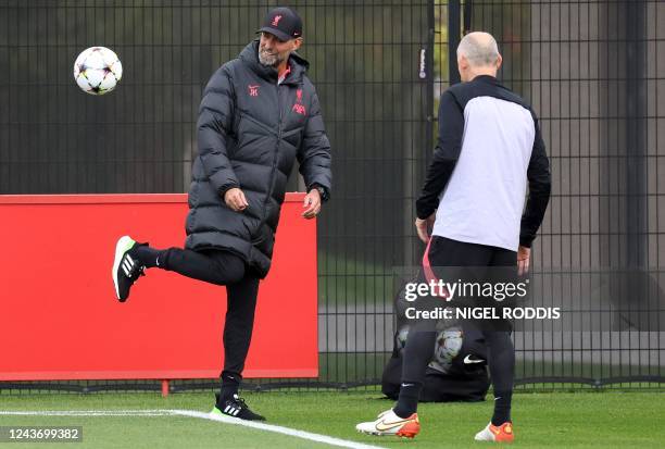 Liverpool's German manager Jurgen Klopp kicks a ball as he takes a team training session at the AXA Training Centre in Liverpool, north-west England...