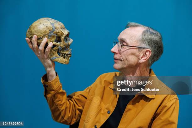 Svante Paabo, Director of the Max Planck Institute for Evolutionary Anthropology, with a model of a Neanderthal skeleton after a press conference...