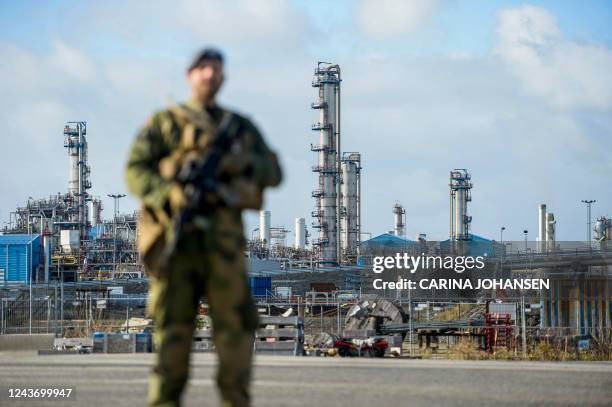 Norwegian Home Guard soldier stands guard, assisting the police with increased security, at the Karst gas processing plant in the Rogaland county,...