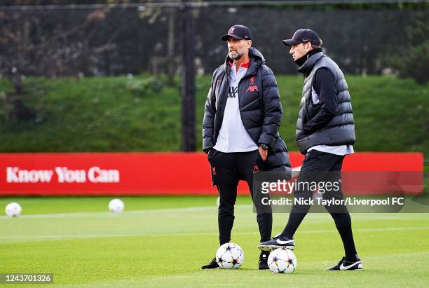 Manager Jurgen Klopp with Peter Krawietz of Liverpool during a training session ahead of their UEFA Champions League group A match against Rangers FC...