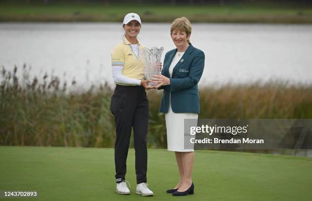 Clare , Ireland - 25 September 2022; Klara Spilkova of Czech Republic is presented with the trophy by Golf Ireland president Kay O'Loughlin after...