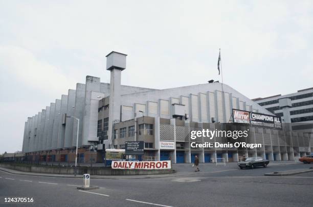 An exterior view of Wembley Arena, London, 1980. The Daily Mirror's Champions All international gymnastics tournament is advertised.