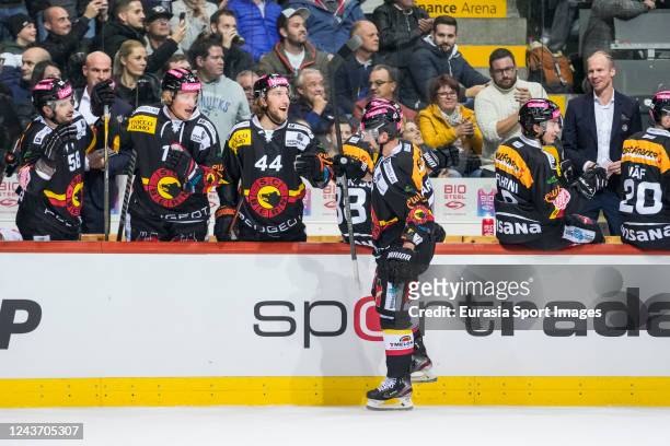 Sven Baertschi of SC Bern skates by the team bench and celebrates his goal with teammates against the Nashville Predators during the 2022 NHL Global...