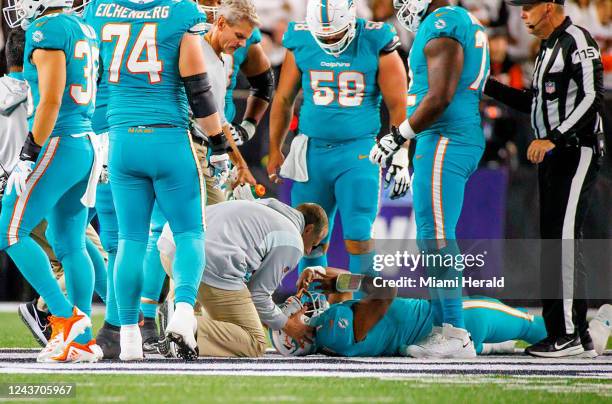 Miami Dolphins quarterback Tua Tagovailoa is attended by medical staff after being sacked by Cincinnati Bengals defensive tackle Josh Tupou during...