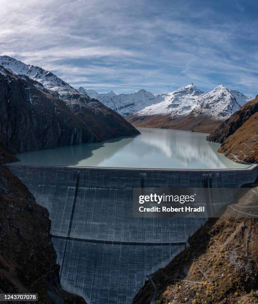 In this aerial view the Grande Dixence dam stands on October 3, 2022 near Heremence, Switzerland. The dam, which at 285 meters is the tallest in...