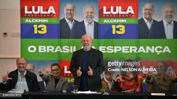 Brazilian former President and candidate for the leftist Workers Party Luiz Inacio Lula da Silva ,gives his thumbs up next to his wife Rosangela...