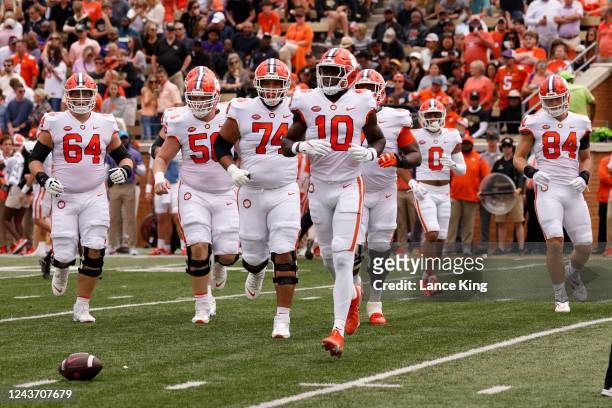 Players of the Clemson Tigers return to the field during their game against the Wake Forest Demon Deacons at Truist Field on September 24, 2022 in...